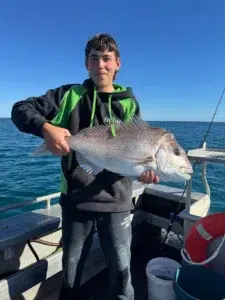 Charley with a big snapper caught in Shark Bay on a Monkey Mia Boat Hire trip